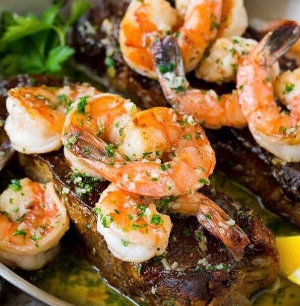 Fresco's Striploin Steak covered in grilled garlic shrimp